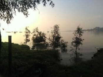 Scenic view of lake against sky during sunset