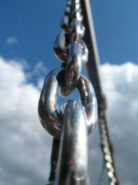 Close-up of chain against sky