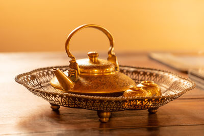 Close-up of old tea light on table