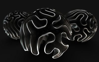 Close-up of illuminated art against black background