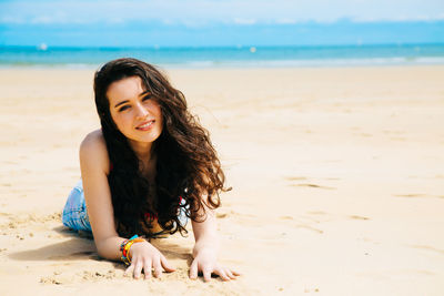 Portrait of smiling woman on beach