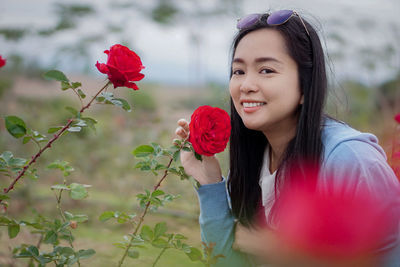 Portrait of young woman with flowers