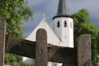 Close-up of metal fence against sky