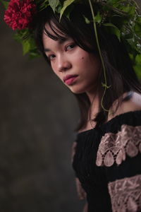 Portrait of a young woman looking away