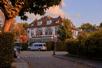 Bussum, the netherlands. beautiful villa in residential area bathed in warm autumnal sunshine.