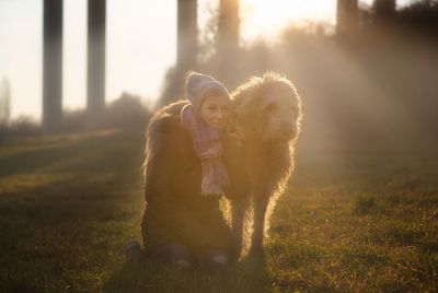 Woman with dog on grass