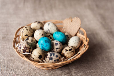 High angle view of eggs in basket on table