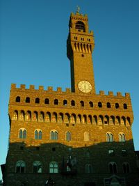 Low angle view of clock tower against sky