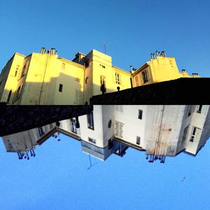 Low angle view of building against clear blue sky