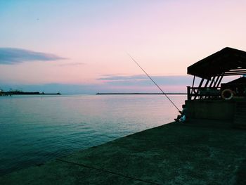 Scenic view of calm sea at sunset