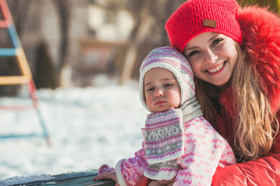 Portrait of a smiling girl in snow