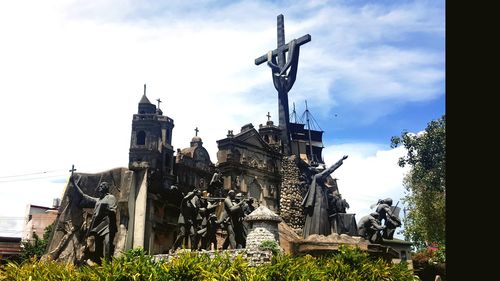 Low angle view of statue against sky