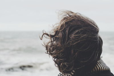 Portrait of man on beach against sky