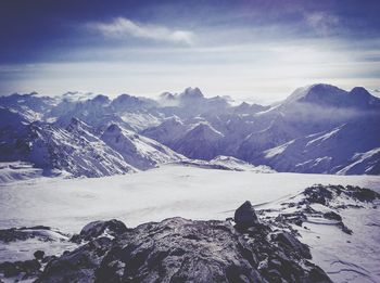 Scenic view of mountains against sky during winter