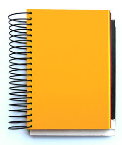 Close-up of yellow paper over white background