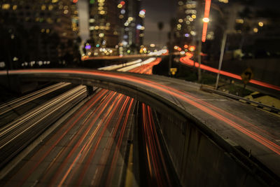 High angle view of light trails on road at night