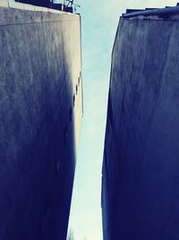 Low angle view of buildings against blue sky