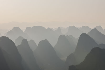 Limstone mountains in the mist around yangshuo in china