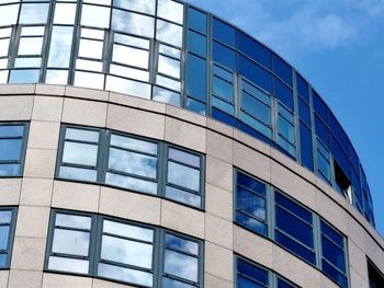 Low angle view of office building against sky