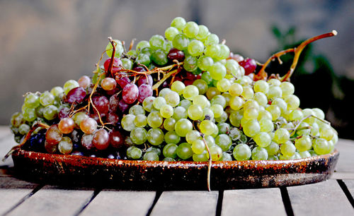 Close-up of grapes bunches on table