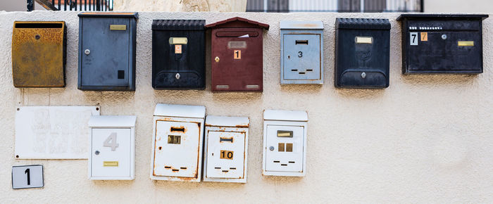 Telephone booth on wall of building