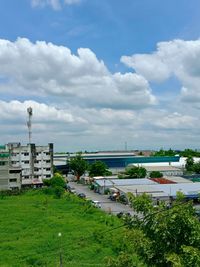 High angle view of buildings and trees against sky