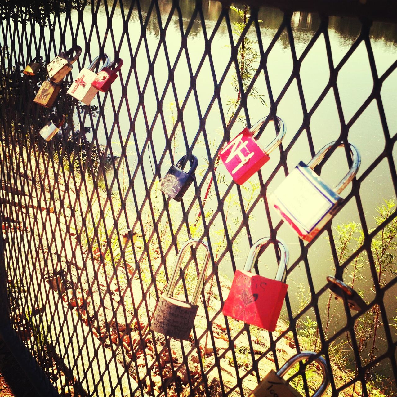 protection, metal, chainlink fence, safety, security, red, padlock, hanging, absence, fence, no people, metallic, playground, day, lock, high angle view, sunlight, empty, chair, outdoors