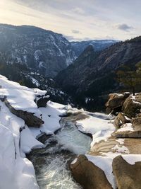 Scenic view of mountains against sky during winter