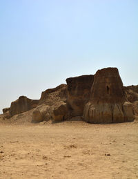 Rock formations in desert against clear sky