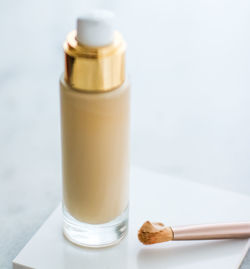 Close-up of nail polish bottle on white background