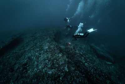 People swimming in sea