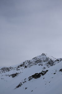 Scenic view of snow covered mountain against sky