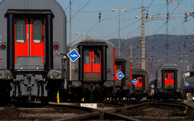 Traveling and passenger transport by train, back of train wagons at the station
