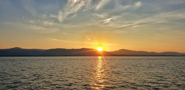 Scenic view of sea against sky during sunset