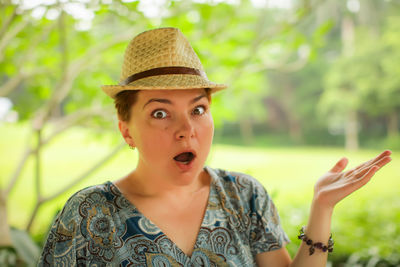 Portrait of young woman wearing hat
