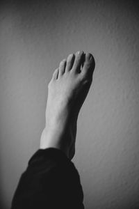 Close-up of woman standing on wall