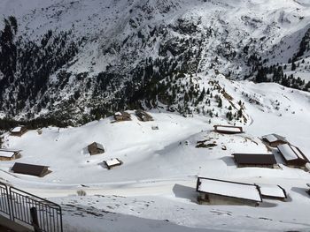 High angle view of snow covered landscape against mountain