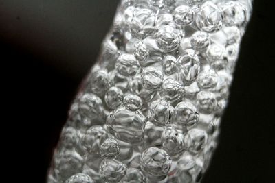 Close-up of glass against black background