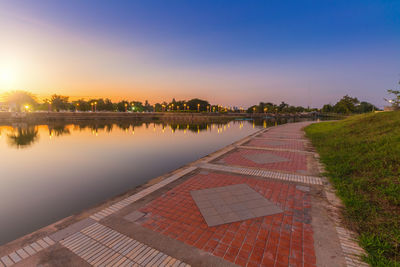 Scenic view of lake against sky during sunset