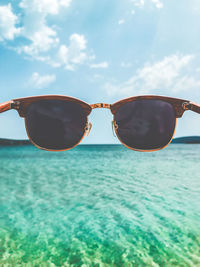 Sunglasses against sea