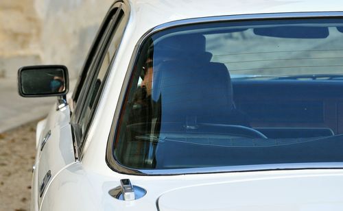 Reflection of car on side-view mirror