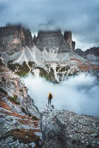 Rear view of man standing on mountain