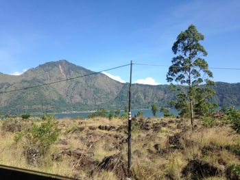 Countryside landscape against mountain range