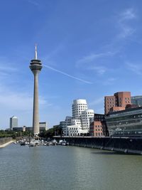 View of buildings in city against sky