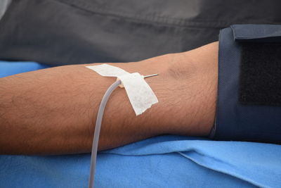 Close-up of man donating blood