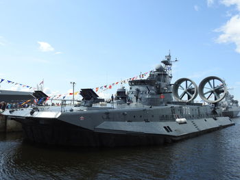 Ship moored in sea against sky