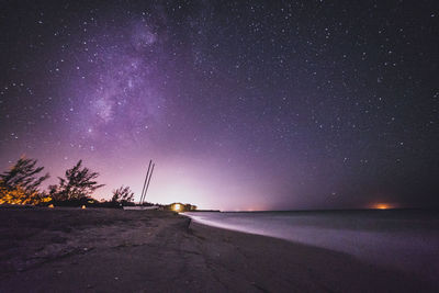 Scenic view of sea against sky at night