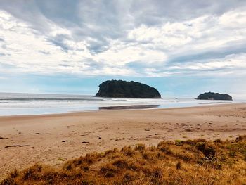 Scenic view of beach against sky
