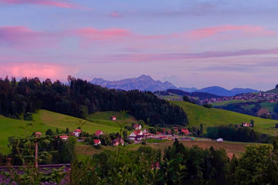 Scenic view of field against sky during sunset