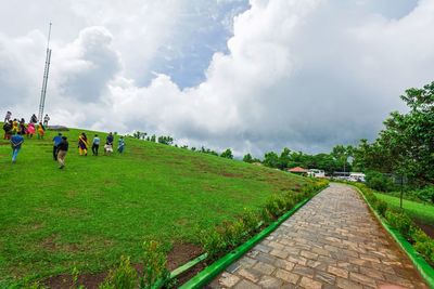 Panoramic view of crowd on road against sky